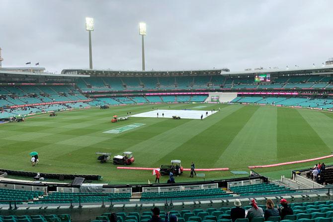 The pitch is kept under covers with the start of play delayed on Day 4 due to rain and poor light