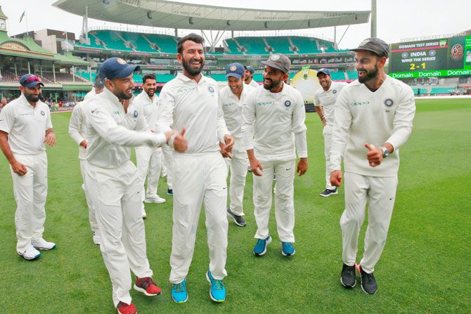 Cheteshwar Pujara is egged on to shake a leg as the Indian team celebrates