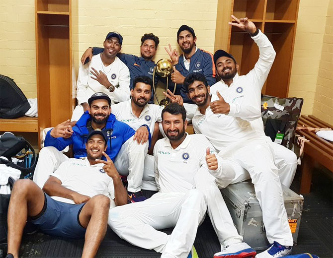 Virat Kohli celebrates with Hardik Pandya, Kuldeep Yadav, Ishant Sharma, Murali Vijay, KL Rahul, Jasprit Bumrah, Cheteshwar Pujara and Mayank Agarwal celebrate in the dressing room