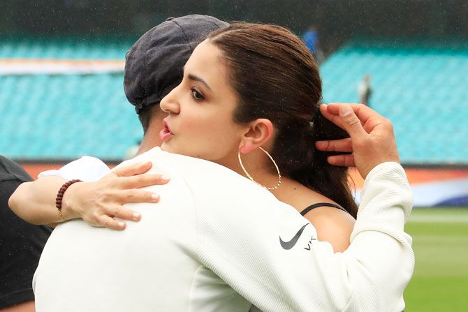 Virat Kohli is embraced by wife Anuskha Sharma after India won the four-match Test series 2-1 on Day 5 of the 4th Test in Sydney on Monday