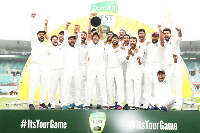 India players celebrate with the trophy after winning the four-match Test series 2-1 at the Sydney Cricket Ground on Monday