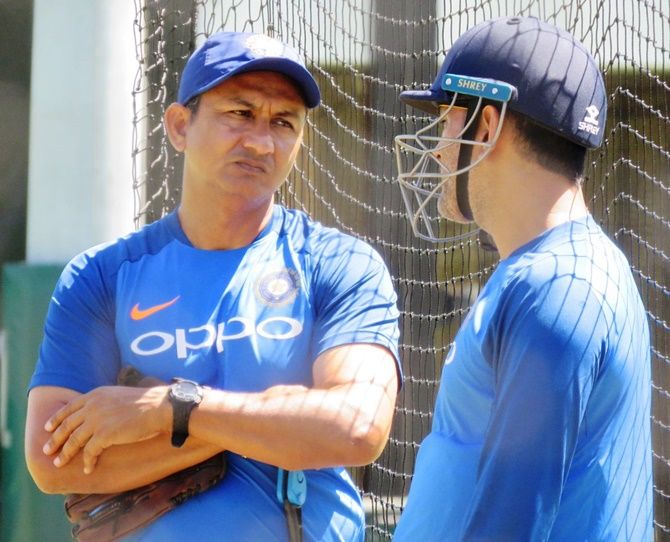 India's batting coach Sanjay Bangar speaks with MS Dhoni during a training session in Sydney on Wednesday