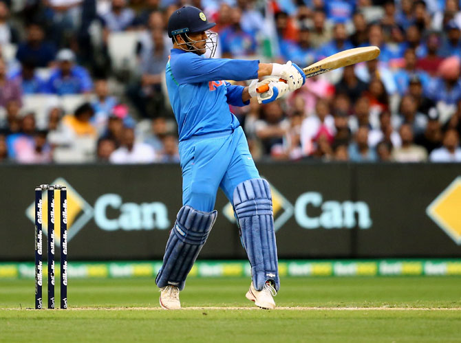 Mahendra Singh Dhoni hits a boundary during his innings of 87 not out in the final game of the One Day International series between Australia and India at Melbourne, January 18, 2019. Photograph: Mike Owen/Getty Images