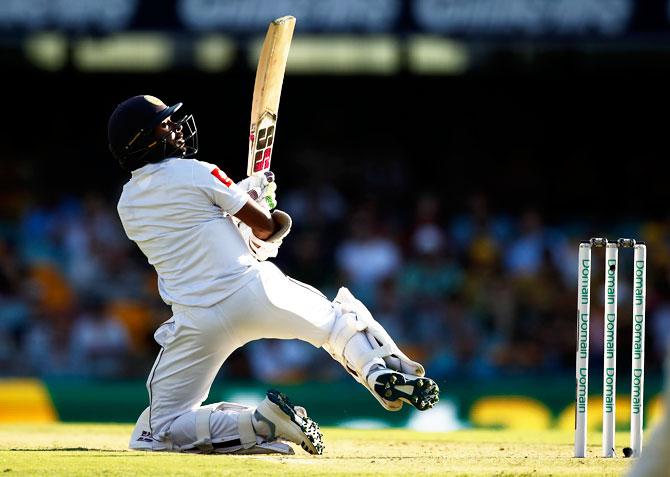 Sri Lanka's Niroshan Dickwella plays an innovative shot 