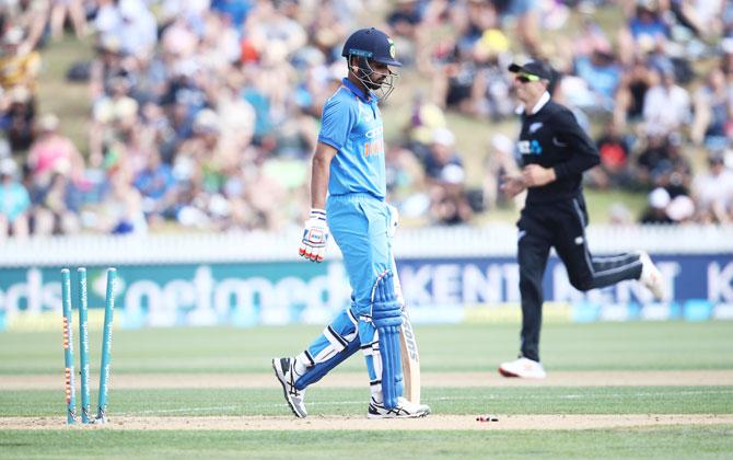 Bhuvneshwar Kumar leaves the field after being bowled by Colin de Grandhomme at Seddon Park on Thursday