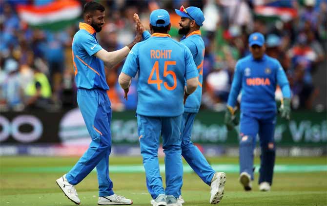 The Indians celebrate the fall of a Bangladesh wicket during the World Cup game in Edgbaston, July 2, 2019