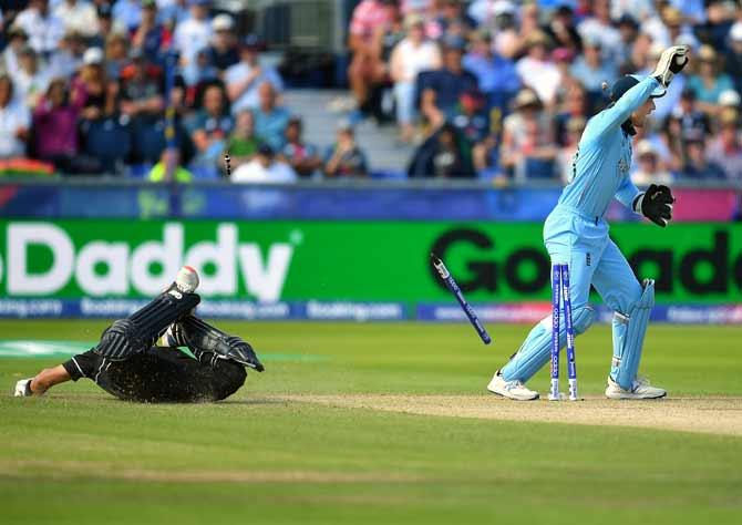 England wicketkeeper Jos Buttler, right, successfully appeals for the run out of New Zealand's Ross Taylor during their match at Chester-le-street, Durham on July 3