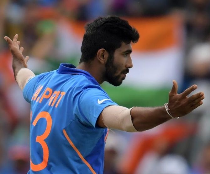 India's pace spearhead Jasprit Bumrah celebrates on taking the wicket of Sri Lanka's Kusal Perera on Sunday