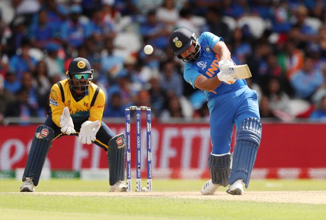 India's Rohit Sharma bats en route his century against Sri Lanka on Saturday