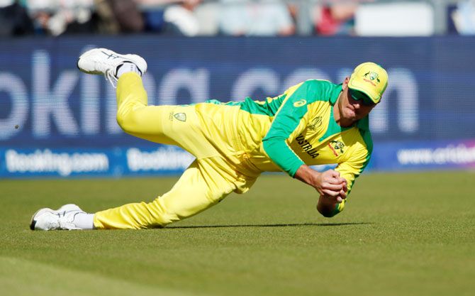 Australia's Marcus Stoinis takes a catch to dismiss South Africa's Jean-Paul Duminy