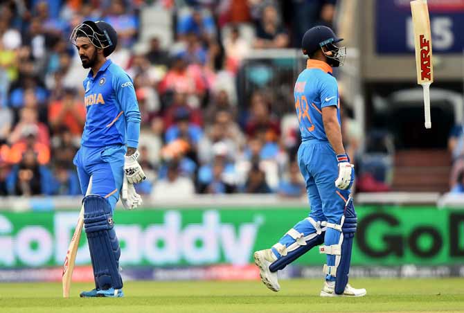  K L Rahul, right, as Virat Kohli walks back after his dismissal during the 2019 ICC World Cup semi-final against New Zealand at Old Trafford in Manchester, last July