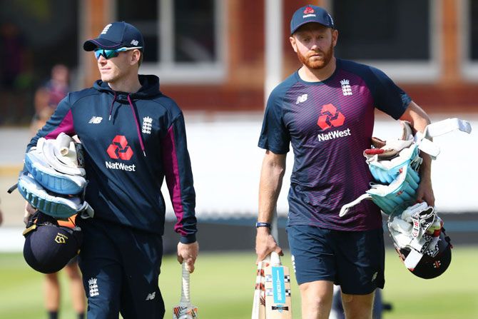  England captain Eoin Morgan (left) and Jonny Bairstow head towards the Nursery End for a nets session on the eve of the ICC Cricket World Cup final against New Zealand at Lord's Cricket Ground on Saturday