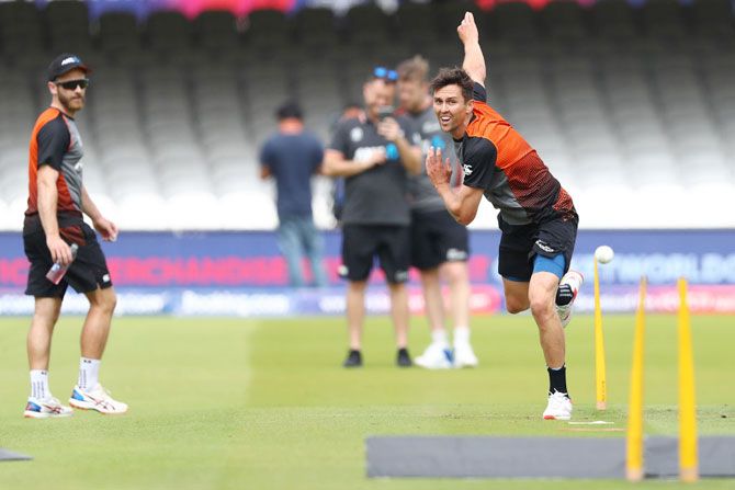New Zealand's Trent Boult bowls in the nets as captain Kane Williamson (left) looks on during a nets session at Lord's Cricket Ground in London on Saturday