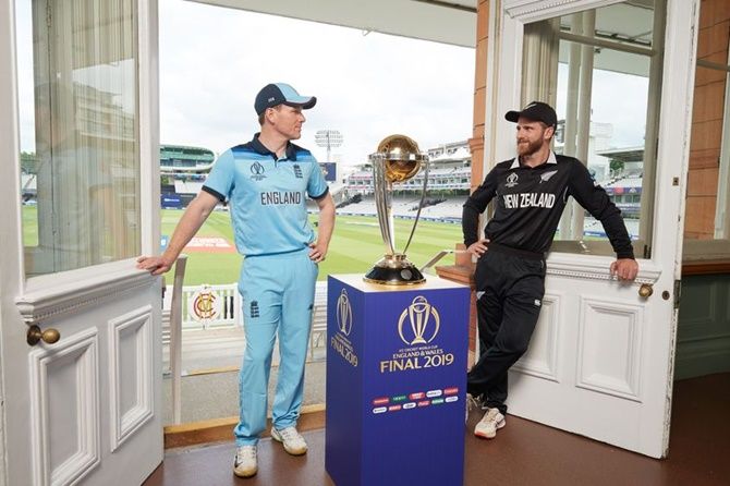 Eoin Morgan and Kane Williamson pose with the ICC World Cup Trophy on the eve of the final, at Lord's