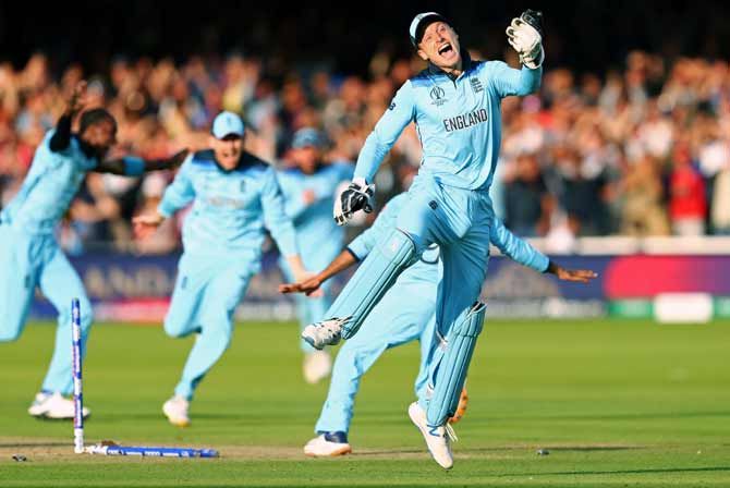 England's players celebrate after winning the World Cup final against New Zealand at Lord's 