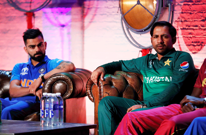 Pakistan's Sarfaraz Ahmed and India's Virat Kohli during a press conference