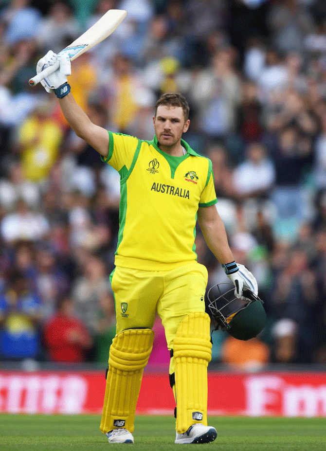 Australia captain Aaron Finch celebrates on completing his century against Sri Lanka at the Oval in London on Saturday