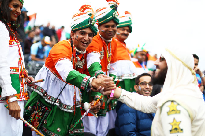 India and Pakistan supporters greet each other before the match