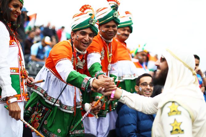 India and Pakistan supporters greet each other before the match