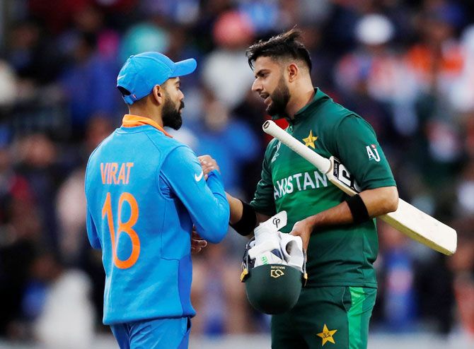 India's Virat Kohil and Pakistan's Shadab Khan share pleasantries after the match