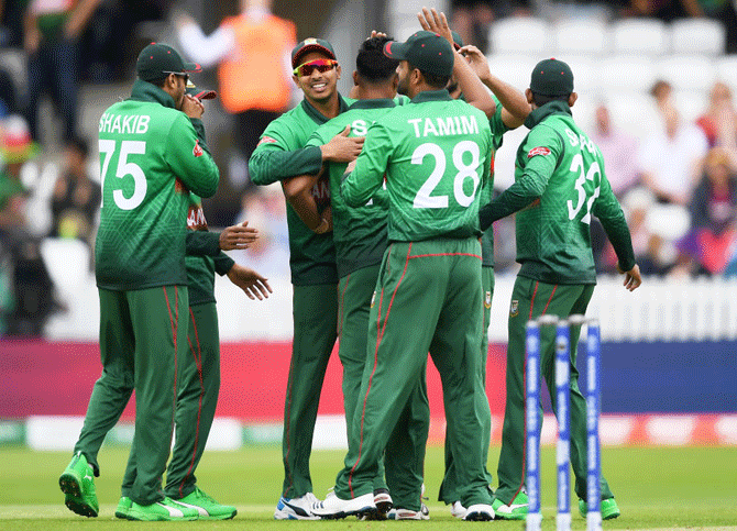 Bangladesh players celebrate the wicket of Chris Gayle