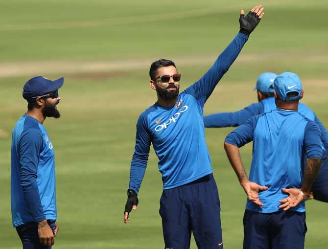 India captain Virat Kohli enjoys a light moment with team mates during a bonding session.