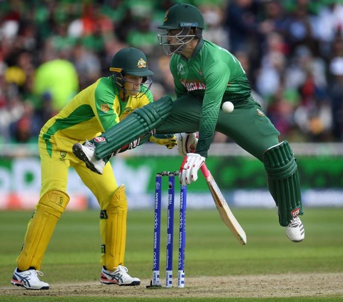 Bangladesh's Tamim Iqbal makes his ground surviving a run-out attempt during the match against Australia on June 20