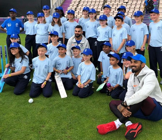 India cricket captain Virat Kohli and his teammate KL Rahul after the cricket clinic for school children on Thursday