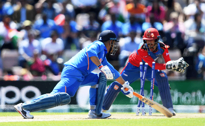 India's Mahendra Singh Dhoni is stumped by Afghanistan's Ikram Ali Khil