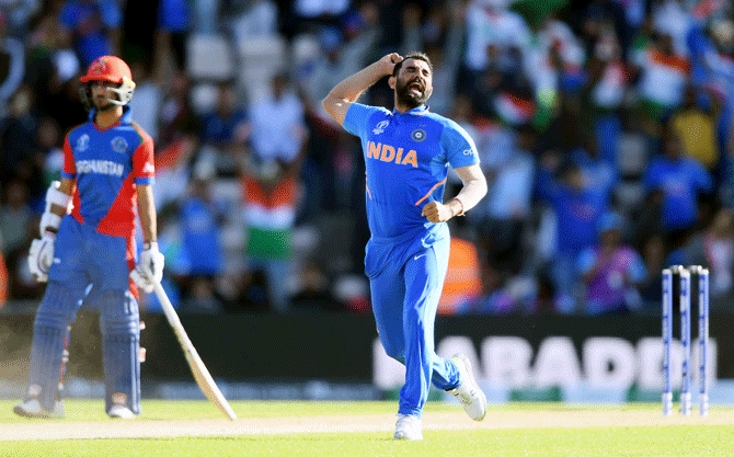 Mohammed Shami celebrates the wicket of Mujeeb Ur Rahman, to complete his hat-trick and give India a last-over victory over Afghanistan at The Hampshire Bowl in Southampton on June 22