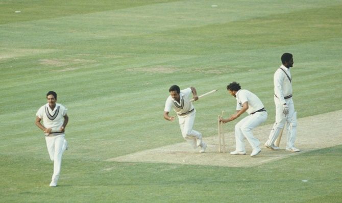 India players Yaspal Sharma and Roger Binny grab souvineir stumps as Mohinder Amarnath, left, runs off the field and West Indies batsman Michael Holding looks on after the 1983 Prudential World Cup final at Lords on June 23, 1983 in London, England.