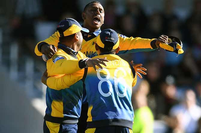 Angelo Matthews of Sri Lanka celebrates with his team after the wicket of Mark Wood of England