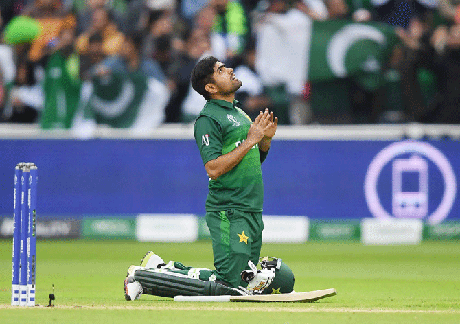 Pakistan's Babar Azam thanks the heavens after completing a century against New Zealand during their Group Stage match of the ICC Cricket World Cup at Edgbaston in Birmingham on Wednesday