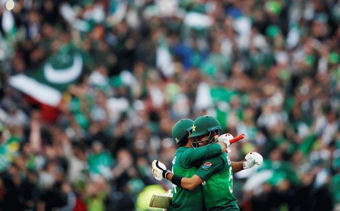 Pakistan's Babar Azam and Sarfaraz Ahmed celebrate after defeating New Zealand in Birmingham on Wednesday