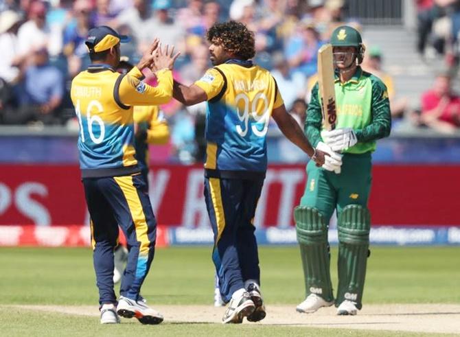  Lasith Malinga celebrates taking the wicket of Quinton de Kock.