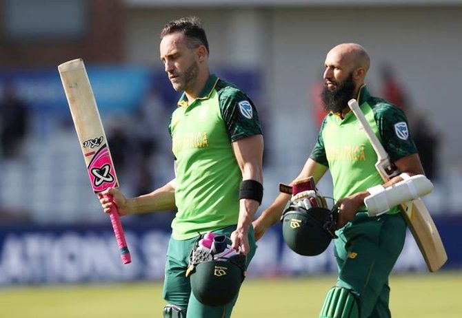 Faf du Plessis and Hashim Amla walk back after guiding South Africa to an easy victory over Sri Lanka in Friday's World Cup match in Chester-le-Street.