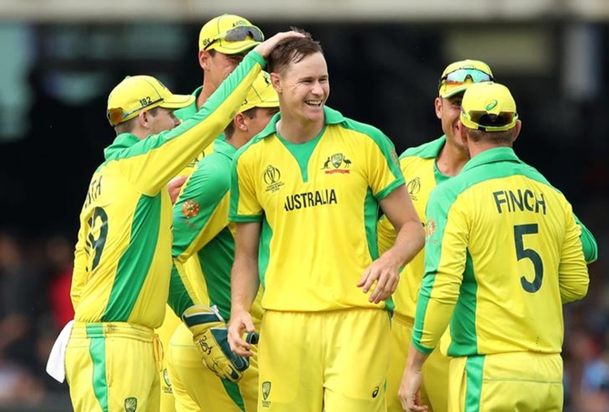 Australia's Jason Behrendorff is congratulated by teammates after taking the wicket of England's Jofra Archer