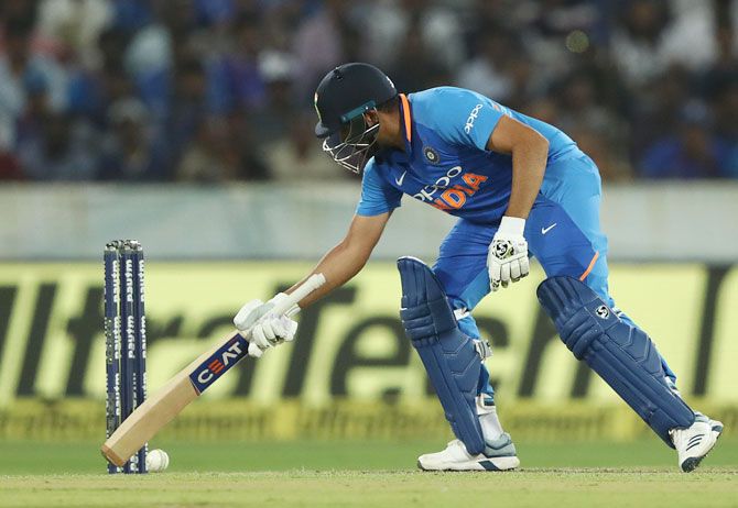 Rohit Sharma stops the ball from rolling towards the stumps