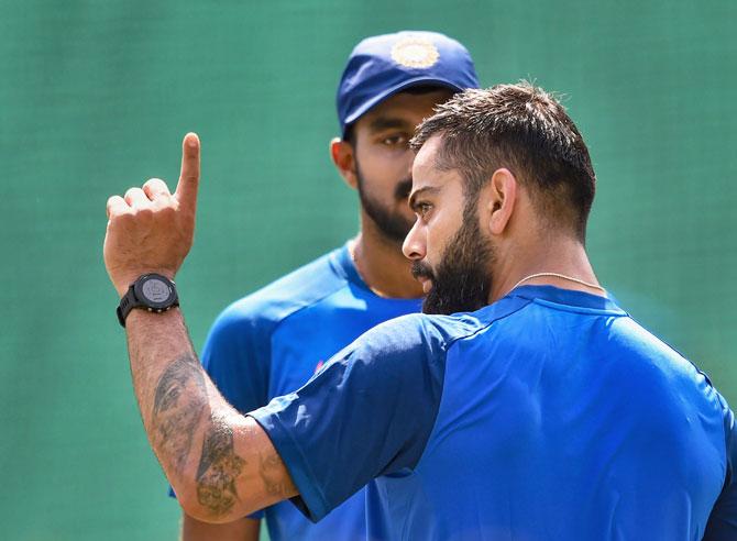 Looks like Virat Kohli has something important to say and he's got the attention of Vijay Shankar 