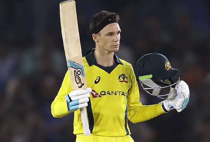 Peter Handscomb celebrates after completing his century against India at Mohali on Sunday