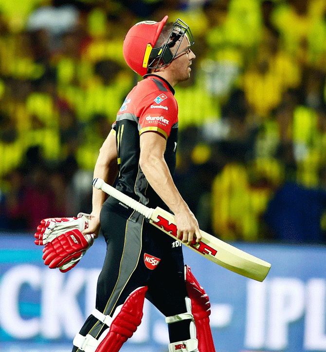Royal Challengers Bangalore' AB de Villiers leaves the field after being dismissed by Harbhajan Singh