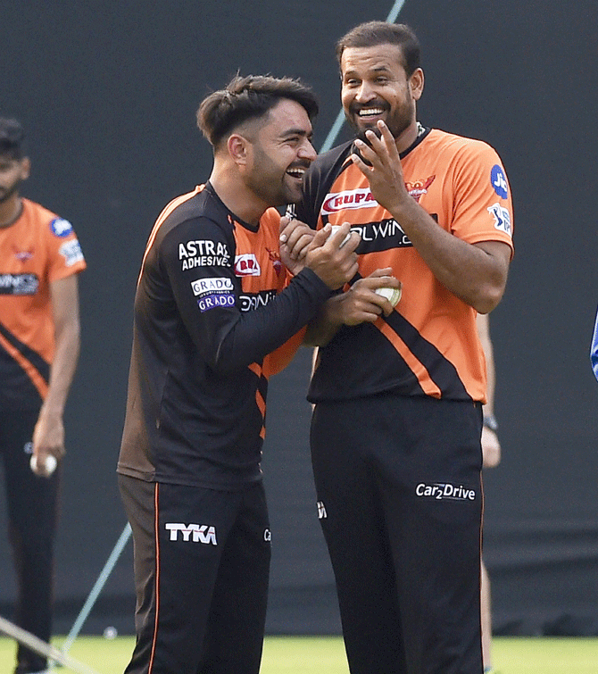 Sunrisers Hyderabad's Rashid Khan and Yusuf Pathan enjoy a light moment during a training session
