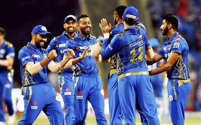 Mumbai Indians' players celebrate the dismissal of Delhi Capitals' captain Shreyas Iyer