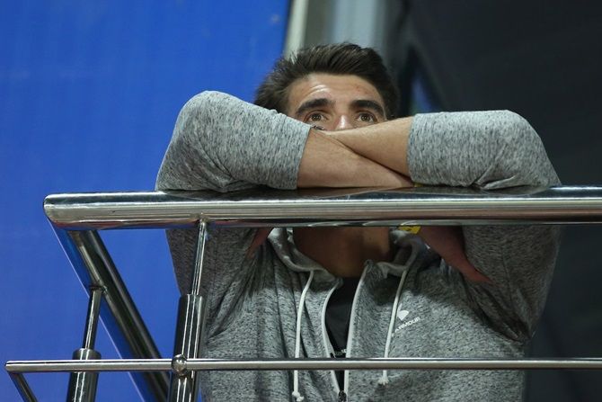 Michael Phelps, winner of 23 Olympic gold medals, watches the IPL match between Chennai Super Kings and Delhi Capitals from the Kotla balcony, in Delhi, on Tuesday, March 26