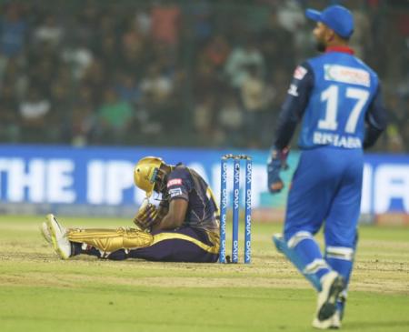 Kolkata Knight Riders' Andre Russell goes to the ground after getting hit on the shoulder during the match against Delhi Capitals on Saturday, March 30