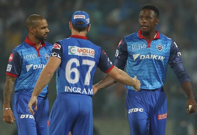 Shikhar Dhawan, left, congratulates Kagiso Rabada, right, after the win against KKR