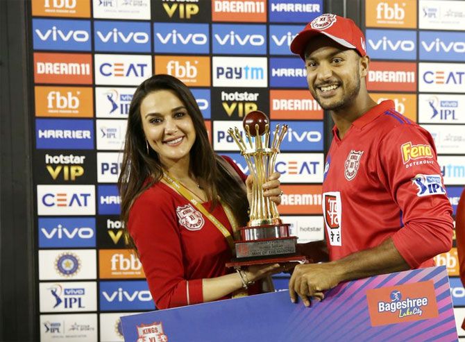 Kings XI Punjab's Mayank Agarwal receives the man-of-the-match award from team owner Preity Zinta after the match against Mumbai Indians on Saturday