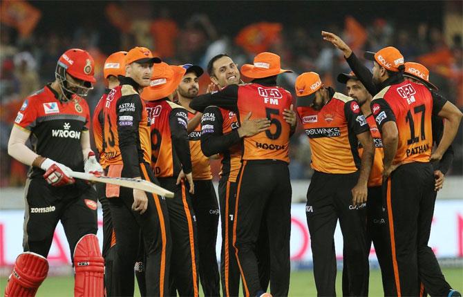 Mohammad Nabi celebrates with teammates after dismissing Shivam Dube