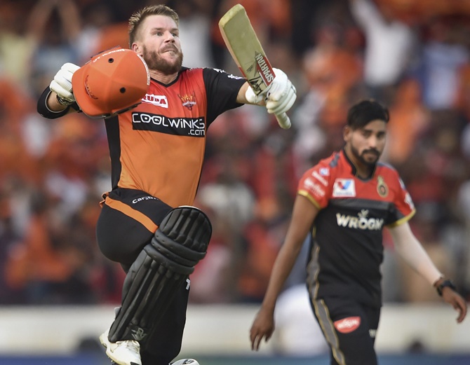 Sunrisers Hyderabad’s David Warner celebrates after reaching his century