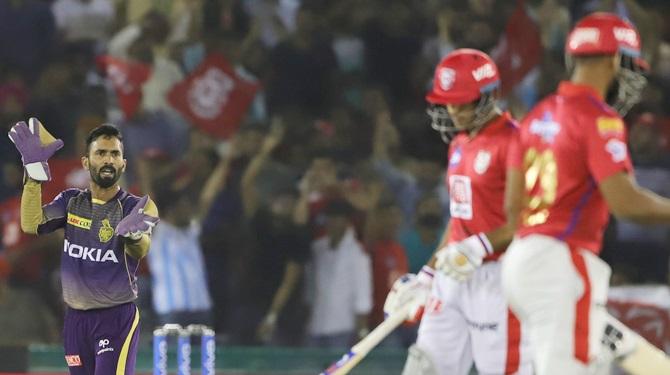 Kolkata Knight Riders captain Dinesh Karthik reacts after a fielding lapse during an IPL match against Kings XI Punjab